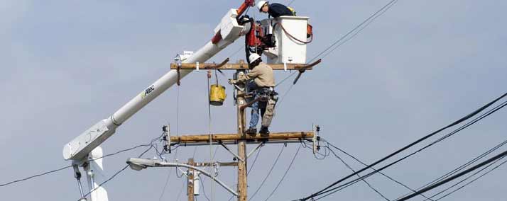 Workers on Electric Pole