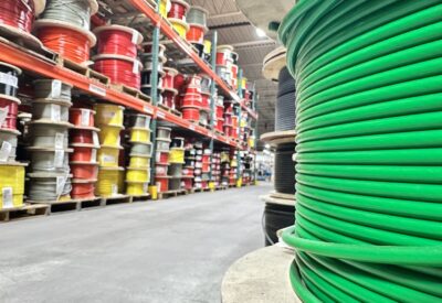 Warehouse full of multi-colored coated cable spools