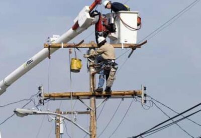 Workers on Electric Pole