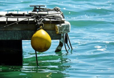 Rope and buoys hanging from a dock