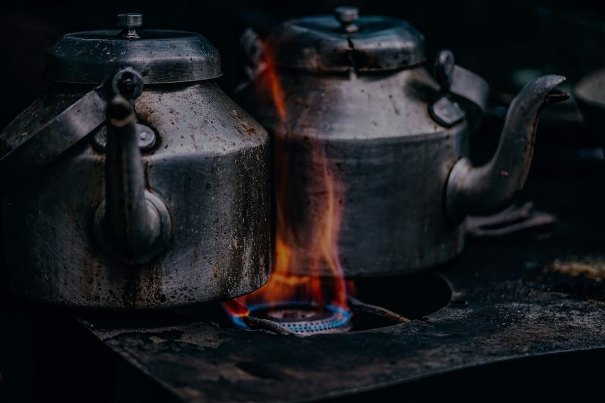 Metal kettles over an open flame